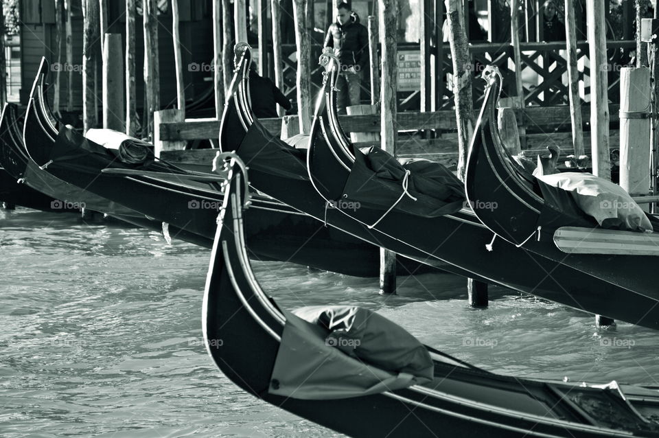Gondolas moored in canal
