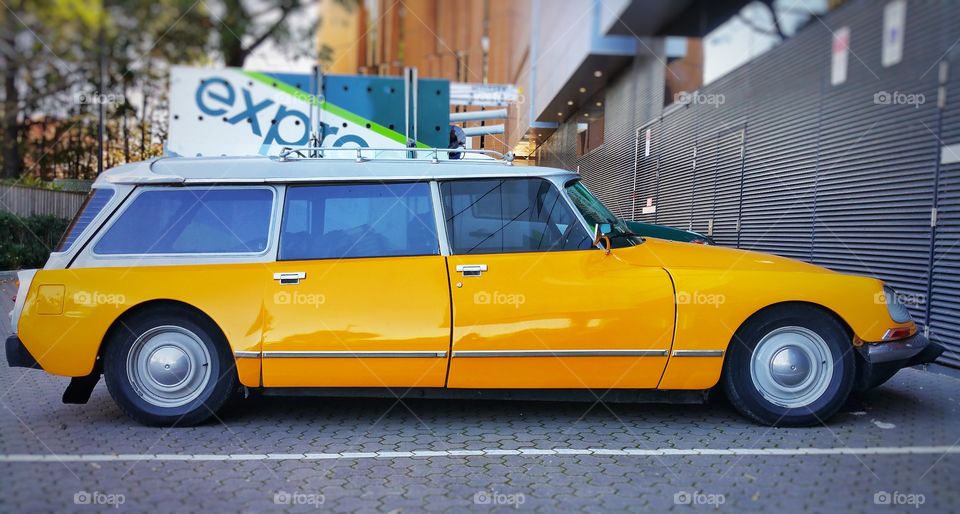 The Citroën DS is a front-engine, front-wheel-drive executive car made in France. It's design resembles that of a platypus and has a cult following. This yellow specimen is a rare station wagon variant.