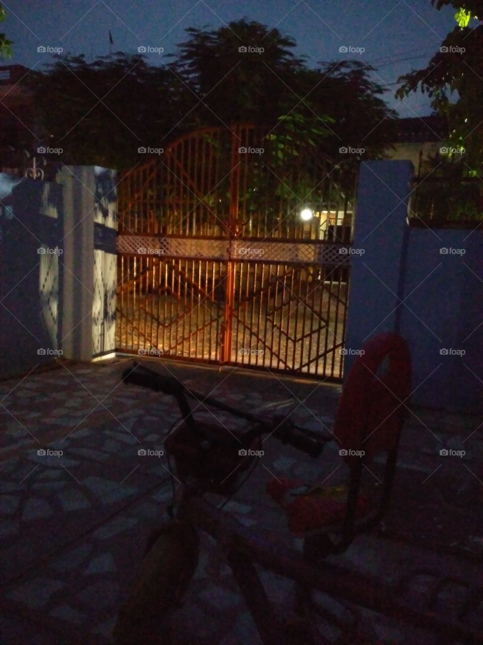 Empty bicycle near gate