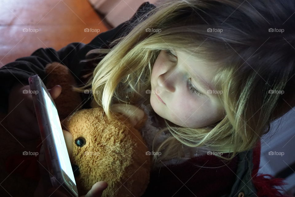 Happiness is ... watching a movie on your favourite gadget with your favourite bear 