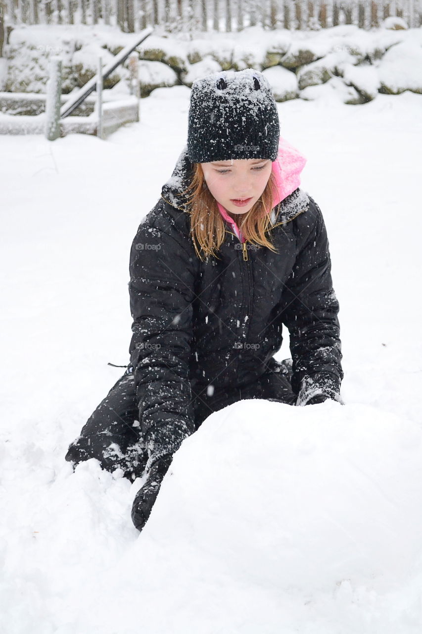 Girl playing in the snow