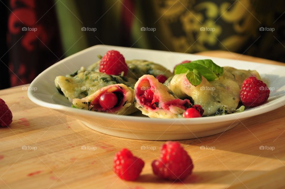 spinach dumplings with berries
