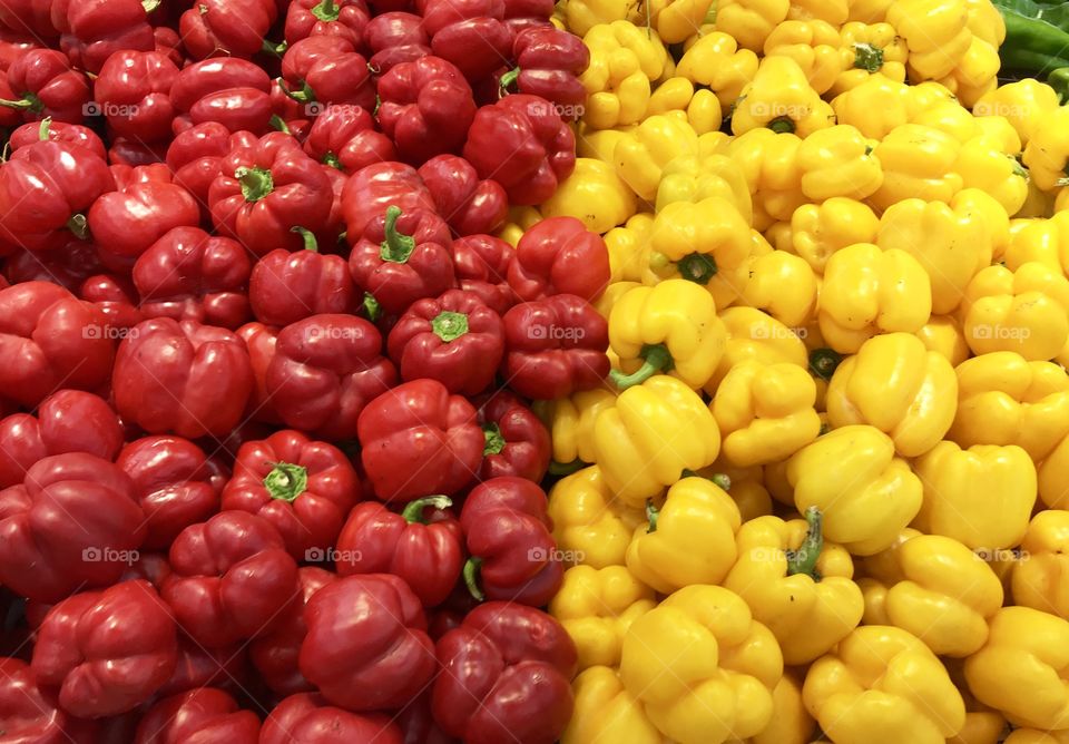 red and yellow peppers at street market