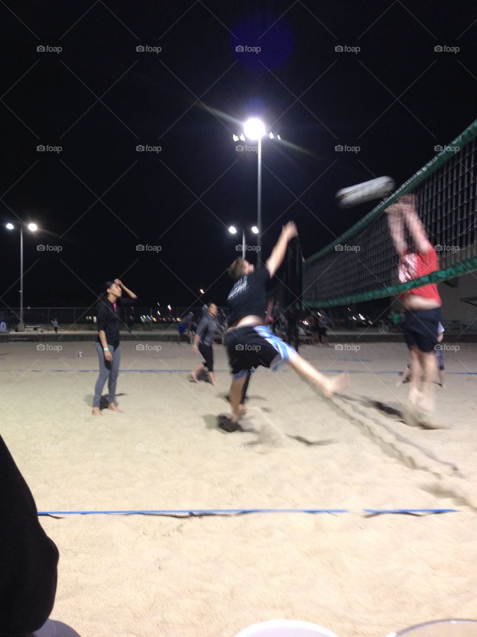 Sand volleyball at night