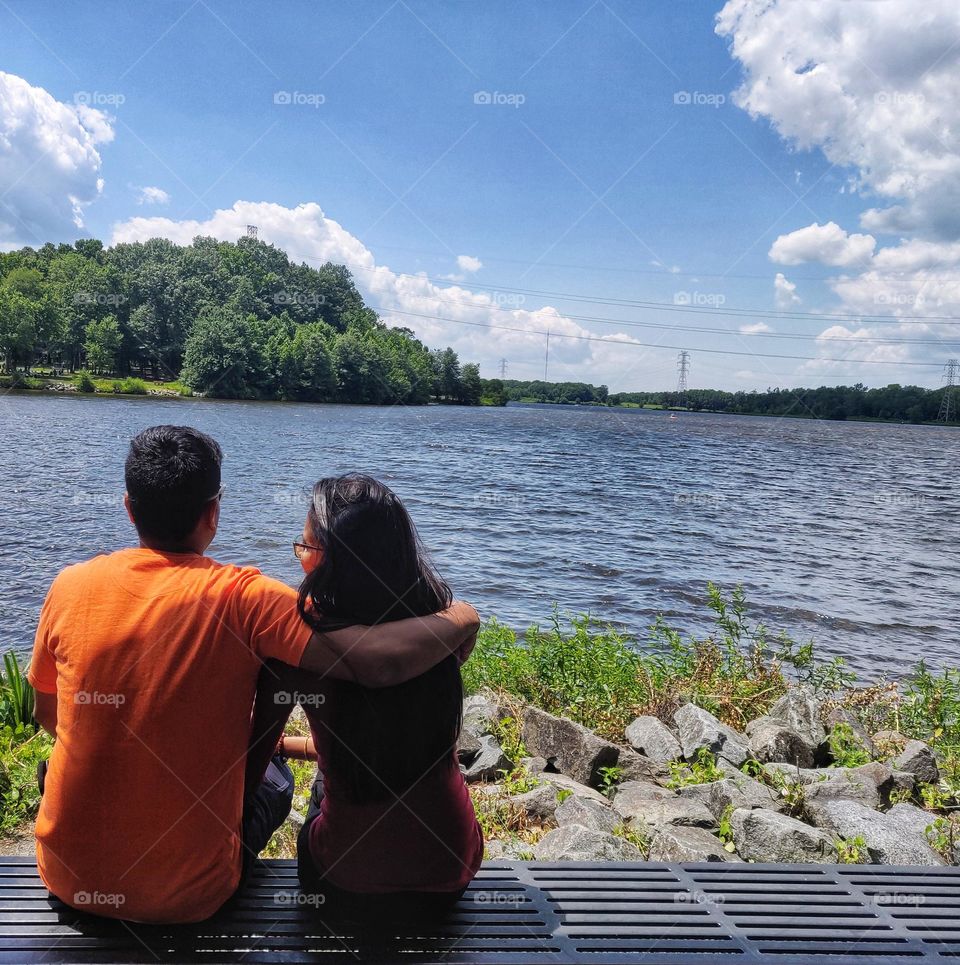 Couple Sitting on the river side