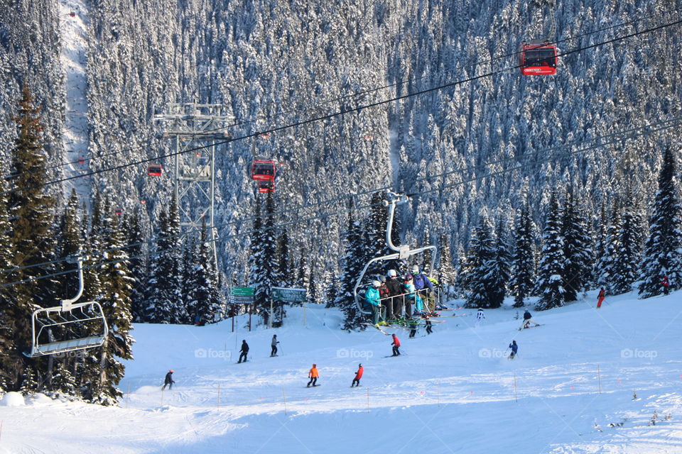 Winter scenery , chairlifts , gondola , people skiing - beautiful ending  of 2019