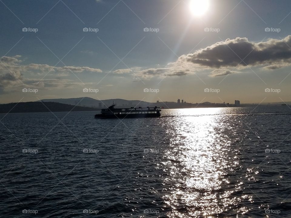 sun rising over a morning ferry in Istanbul Turkey