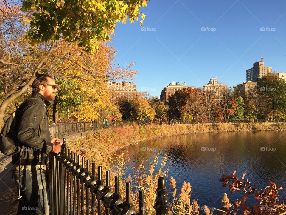 Hipster Walks through Central Park in the Fall 