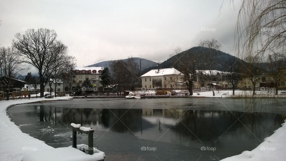Lake in winter time. Puchberg village, Austria,Europe