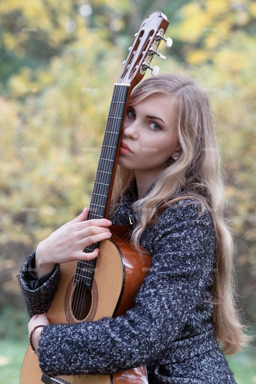 girl playing guitar