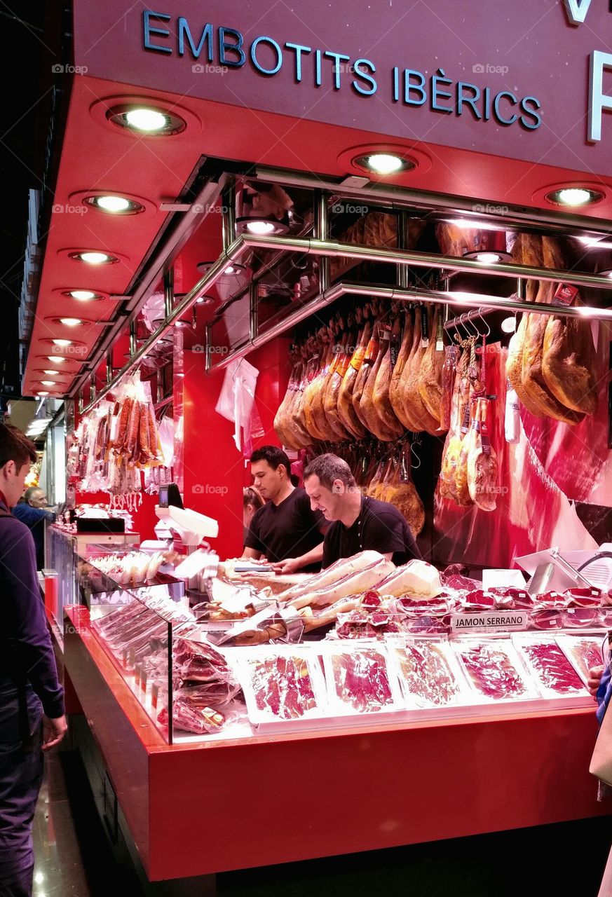 Delicatessen Shop where to get typical spanish ham La Boqueria, Barcelona, Spain