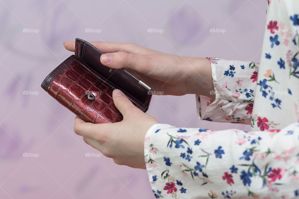 girl is holding a wallet