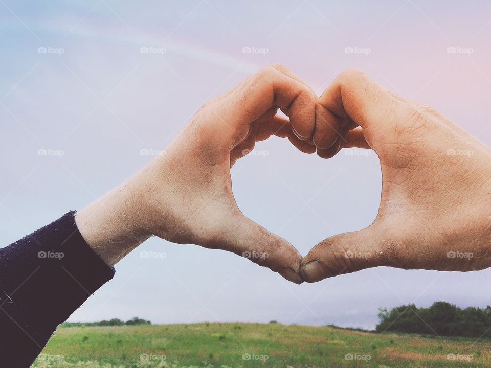 Heart. A man doing a heart with his hands