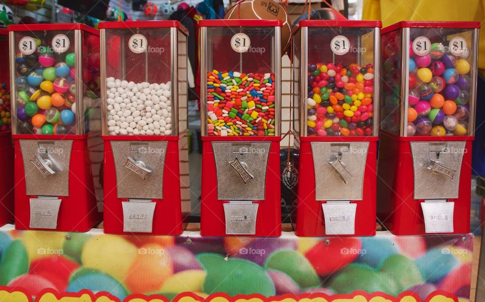 Colorful coin operated candy and toy dispensers in an indoor market in San Miguel de Allende,Mexico.