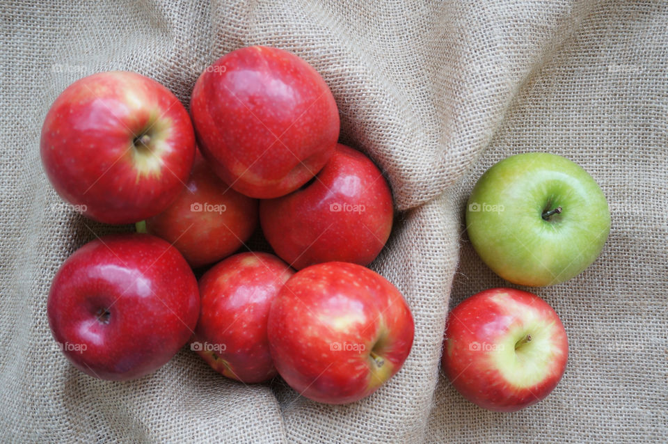 Apples isolated on sackcloth background 