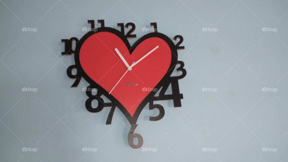 love symbol red colour clock 
loveable it 
red colour clock