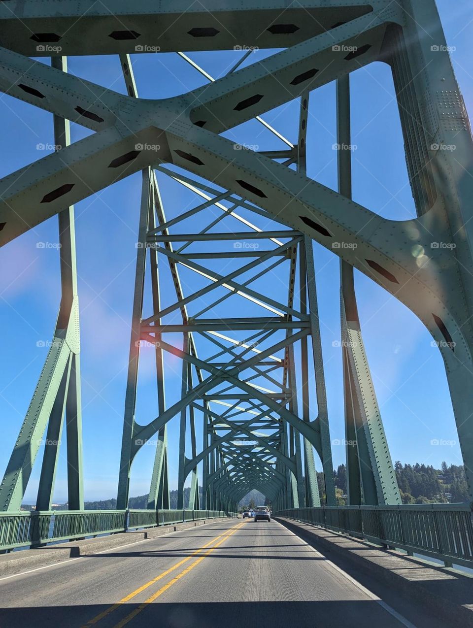 turquoise bridge with intricate architectural design, ridge design, criss cross design, bridge supports