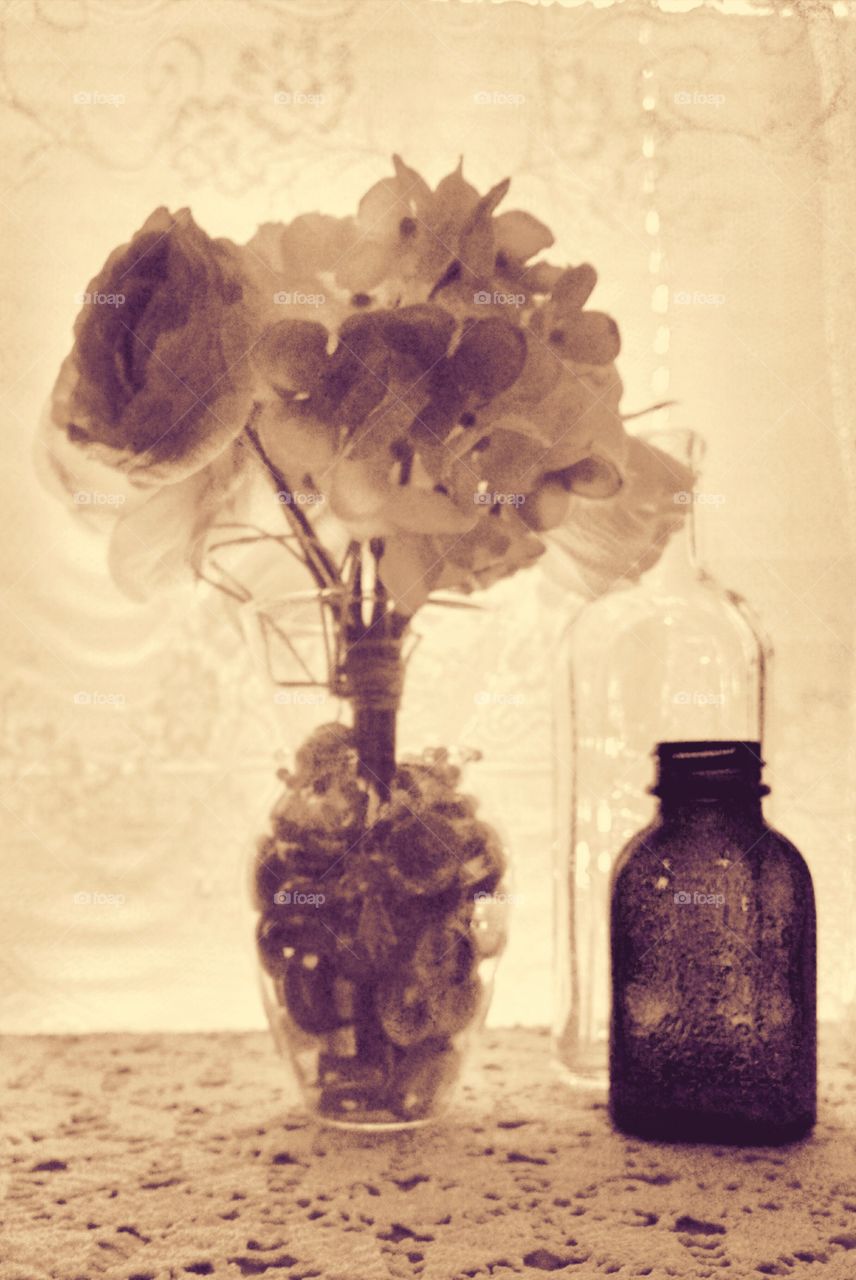 Flowers. Flowers with antique bottles 