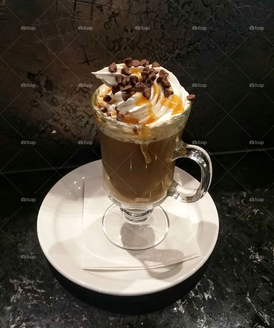 A special coffee with wipped cream, caramel and chocolat chips