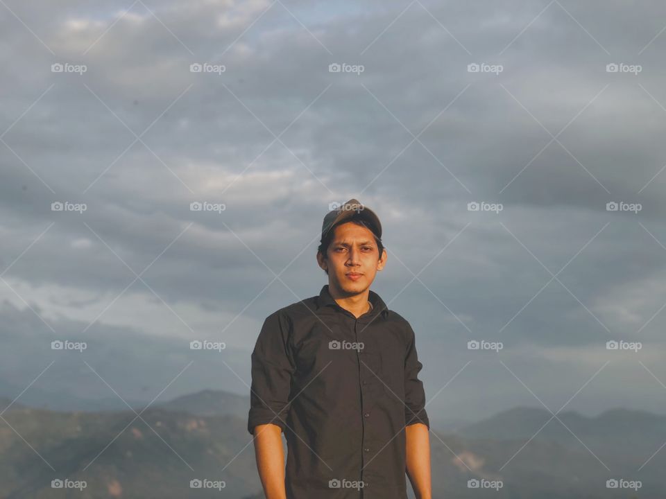 A man top of the hills