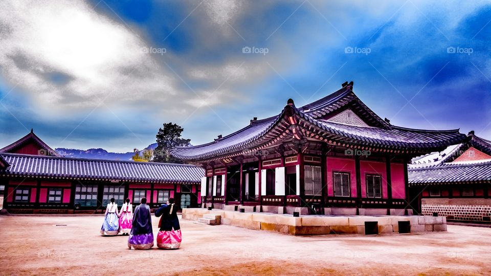 traditional clothing korean girls walking in kyeongbokgung palace Seoul Korea