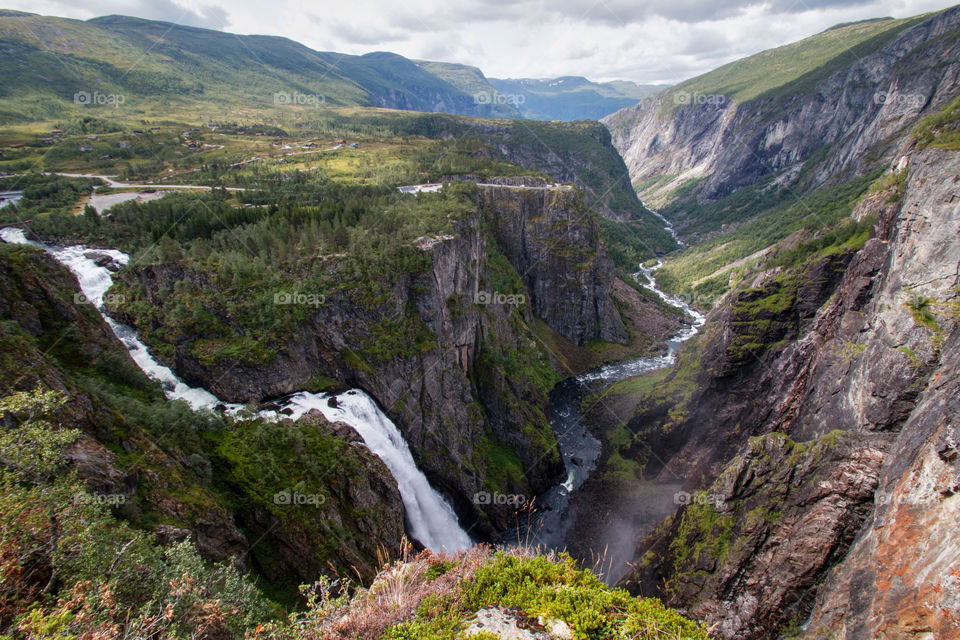Waterfall in Norway with a beautiful valley