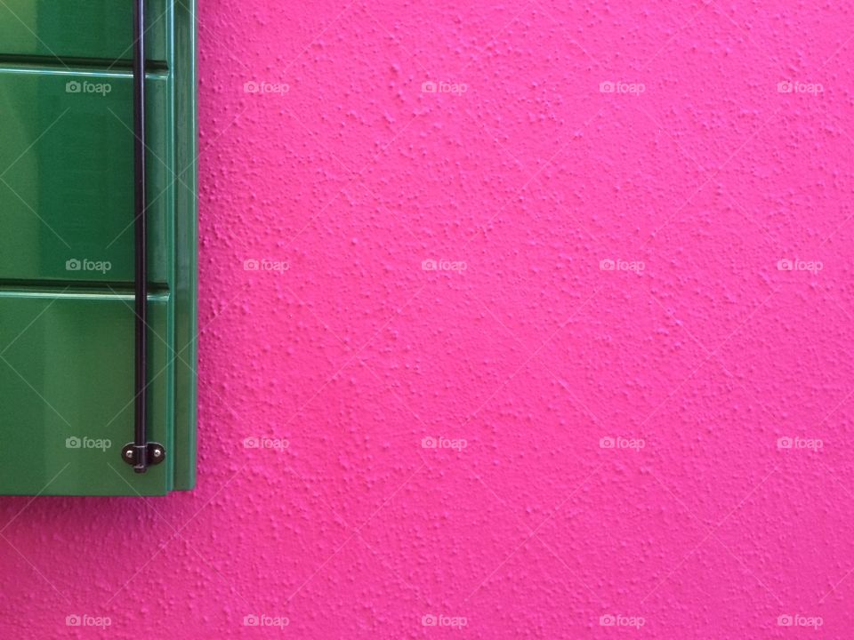 Green window on pink wall background 