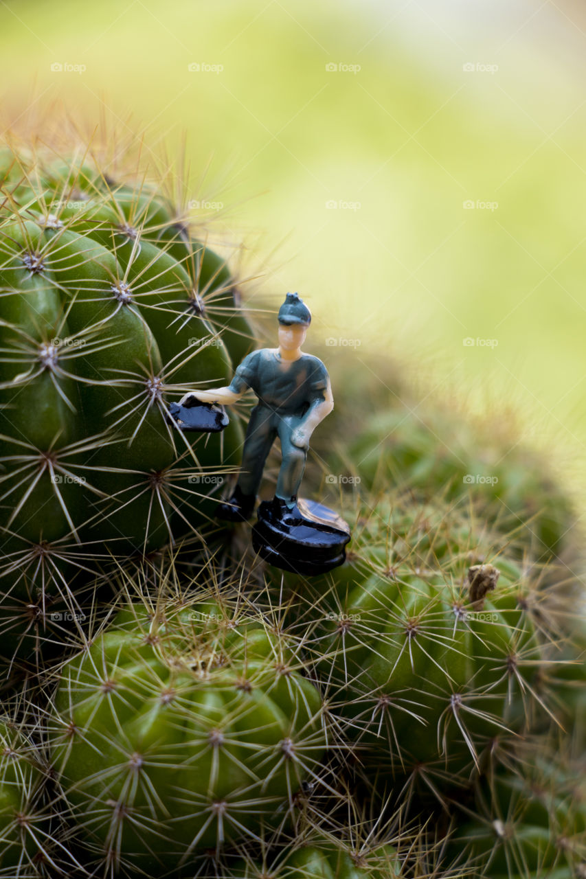 A model making about labor from Sandbox Model. The workers are working construction with cactus in a pot.