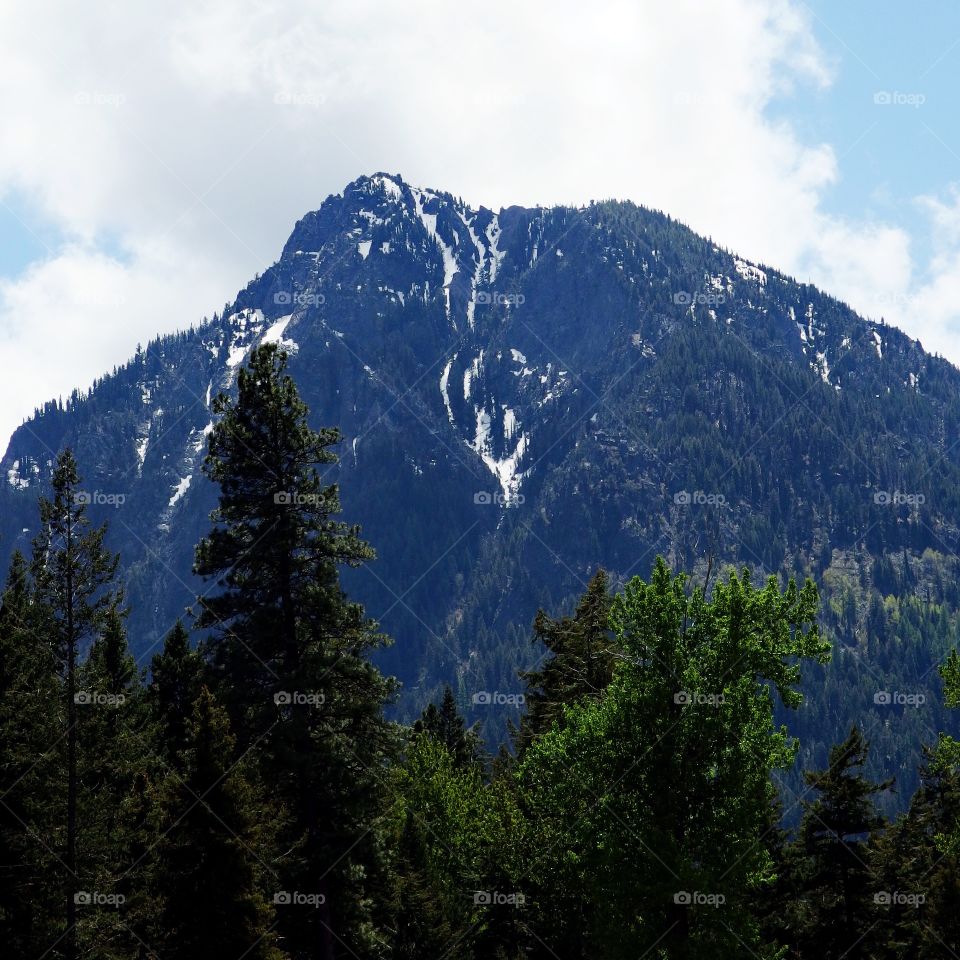 A beautiful mountain peak with snow in Eastern Oregon on a spring day. 