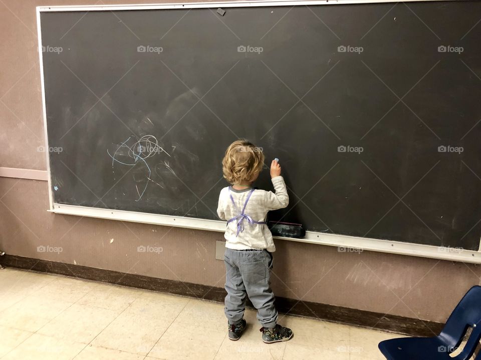 Little boy and the big chalkboard 