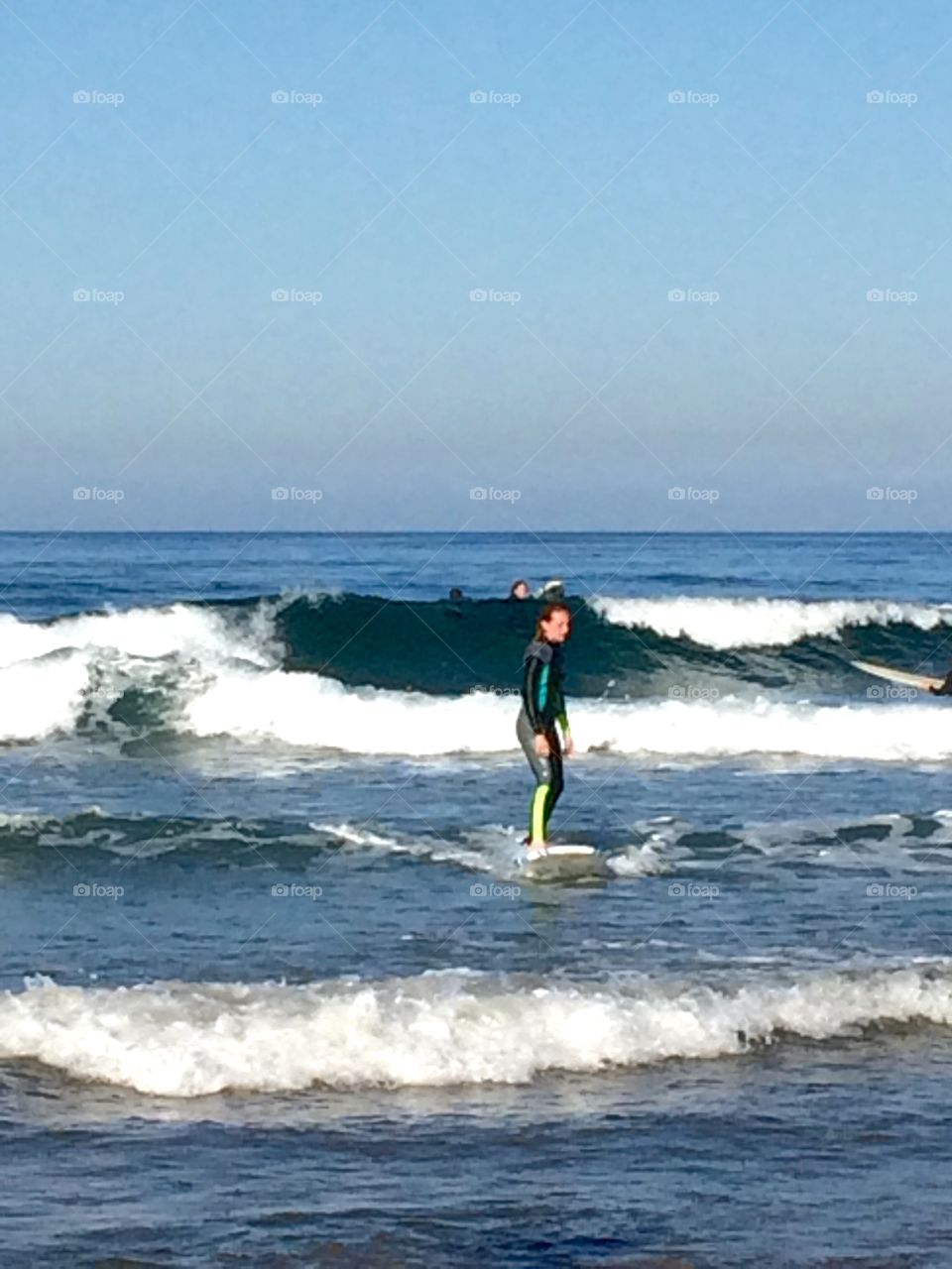 Smooth waves. Surfer in Newport Beach