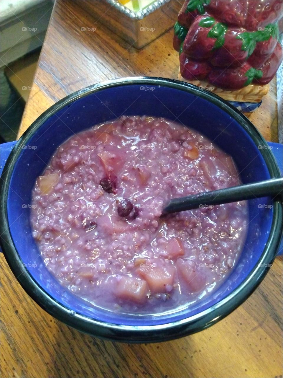 A hardy breakfast bowl of delicious steel cut oatmeal with apples and blueberries make for a good morning.