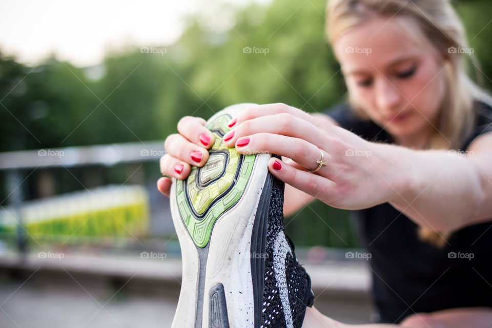 woman stretching after running 