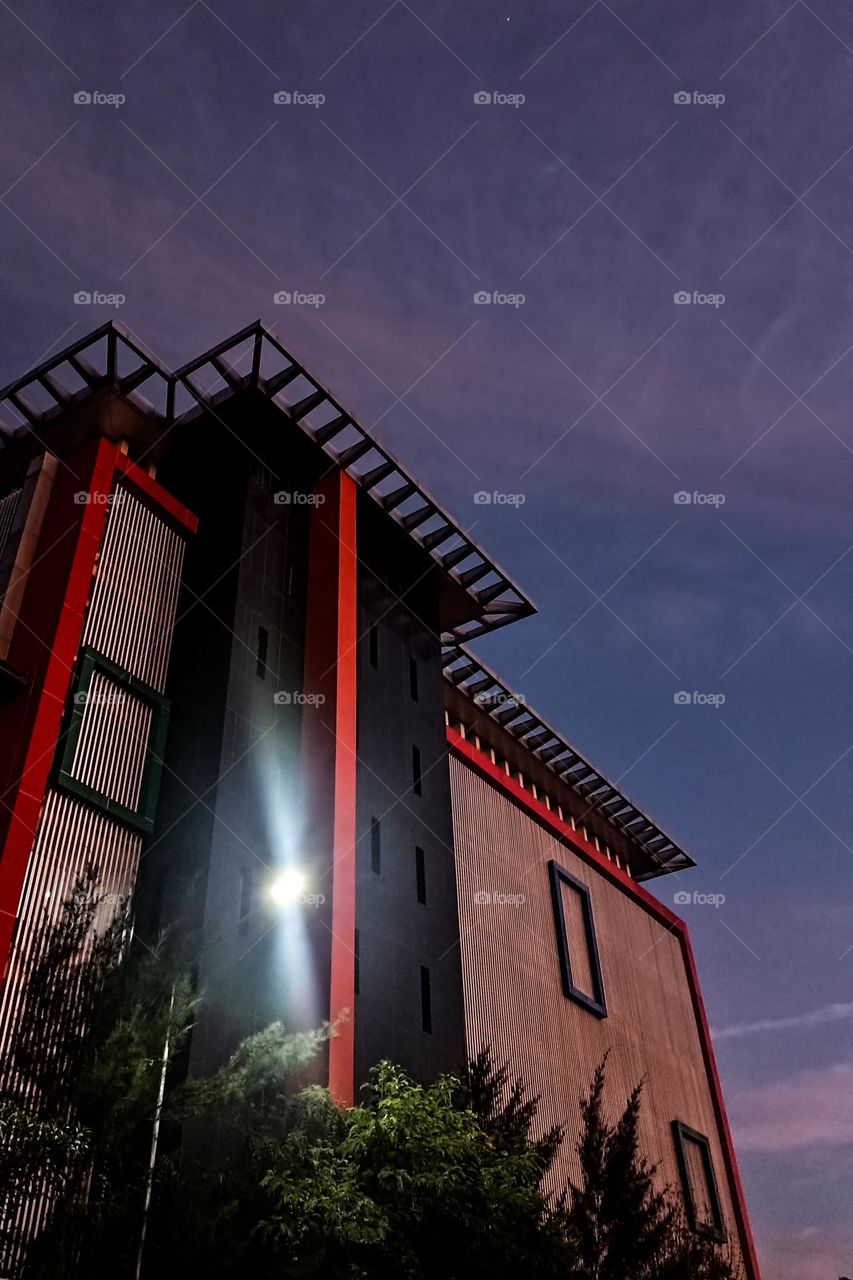 Multi-storey building early in the morning in low angle view