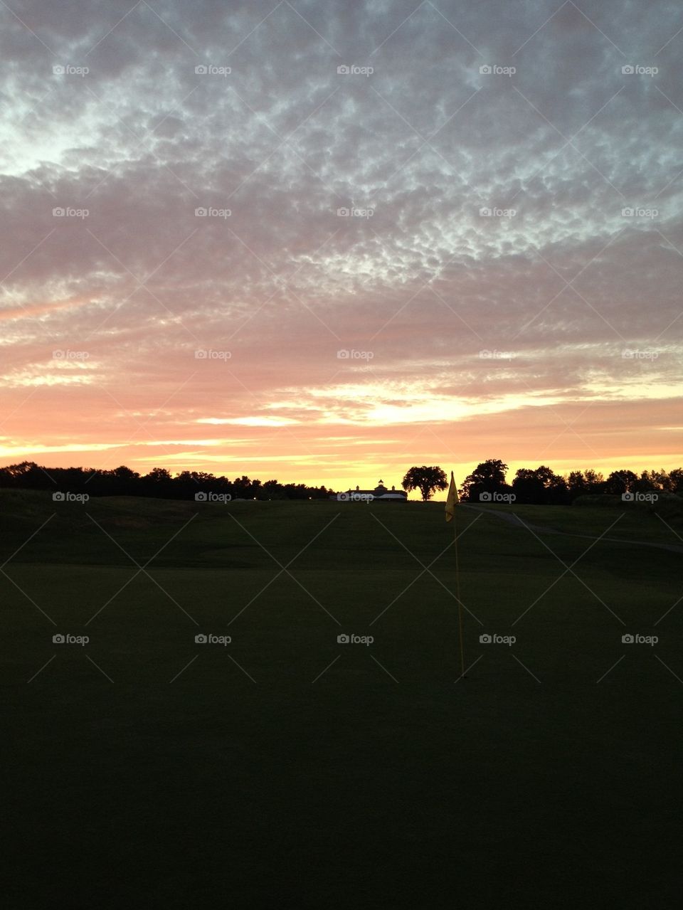 Golf Course sunset with clubhouse 