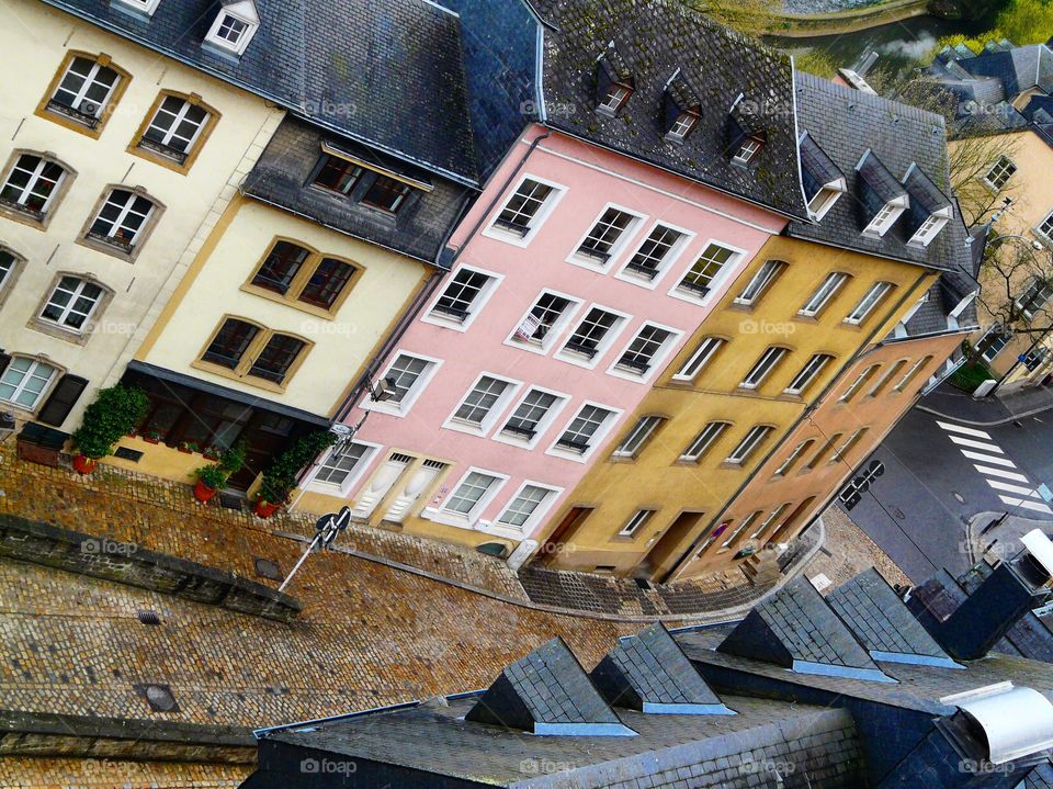 A street in Luxembourg with colorful buildings on a rainy spring day
