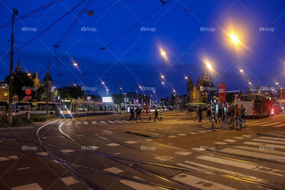 Trams and buses on the road of Amsterdam.