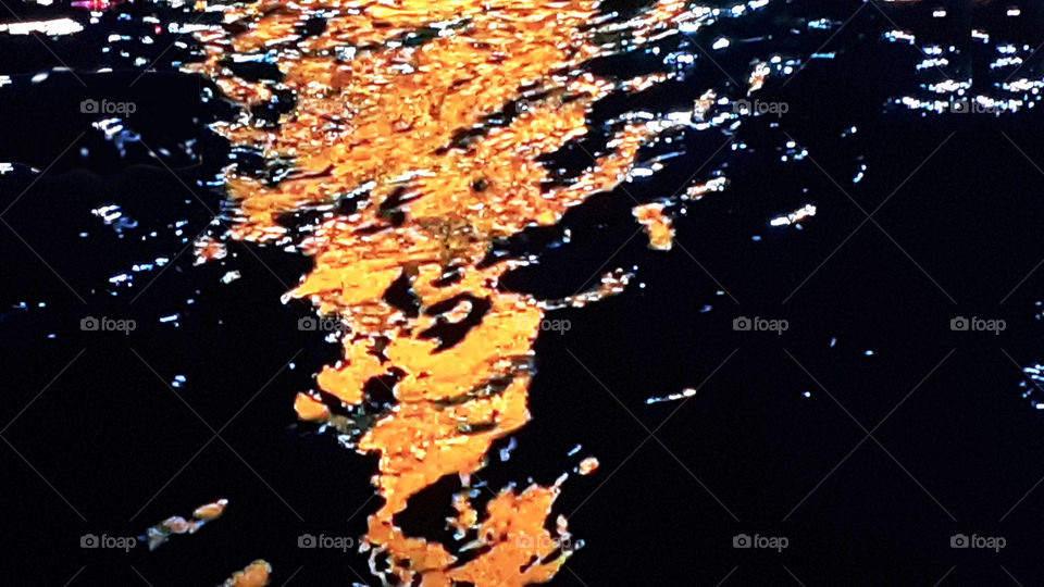 neon light on the water surface