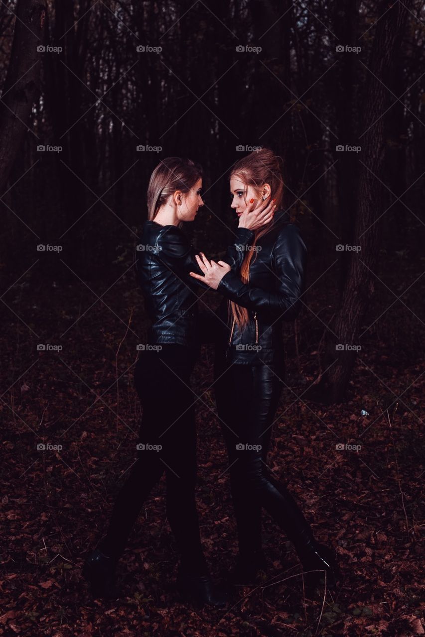 two beautiful girls in leather jackets