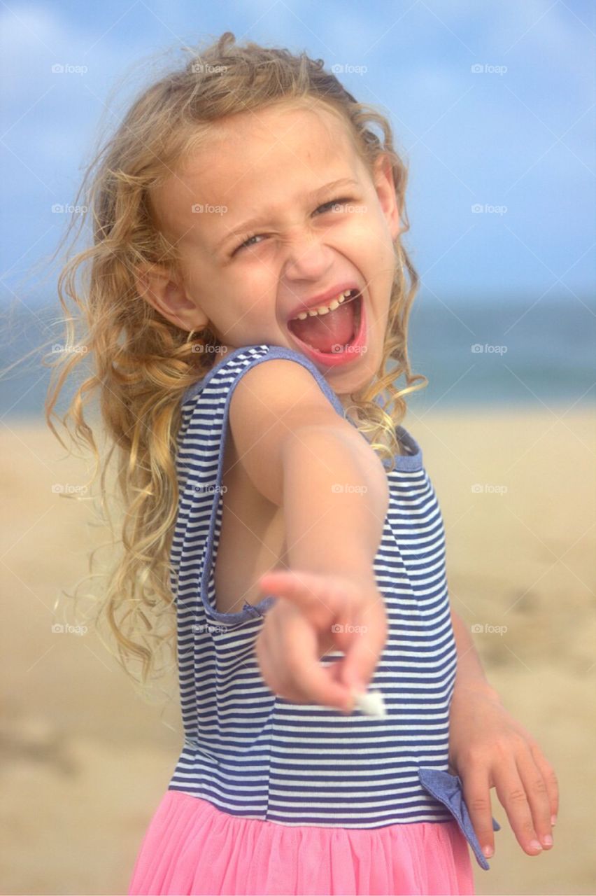 Portrait of a smiling girl enjoying at beach