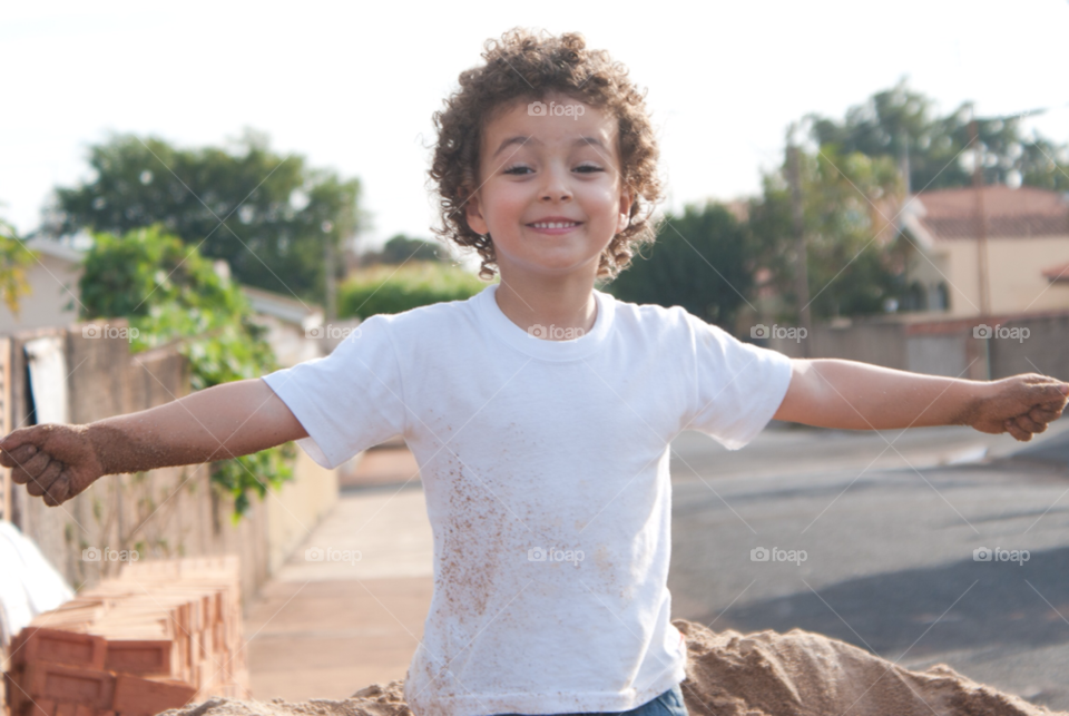 happy child playing sand by arthurmb