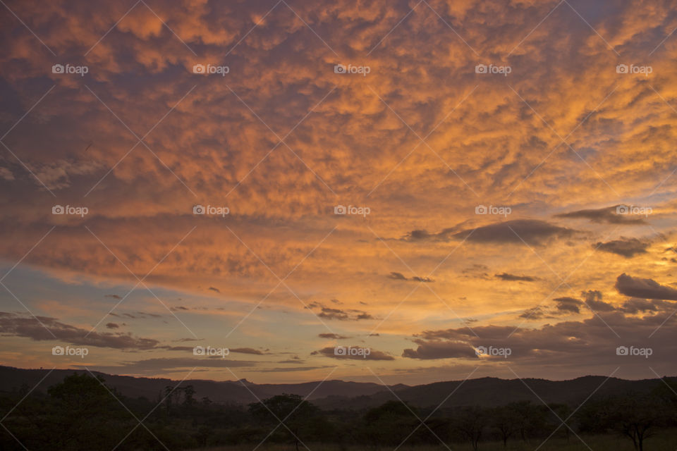 Sunset over the mountains with some cloud cover