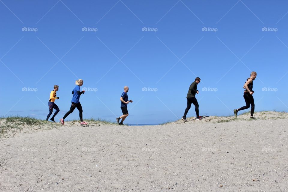 Runners by the beach