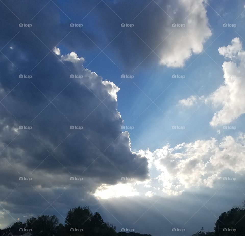 sunshine in the clouds beaming