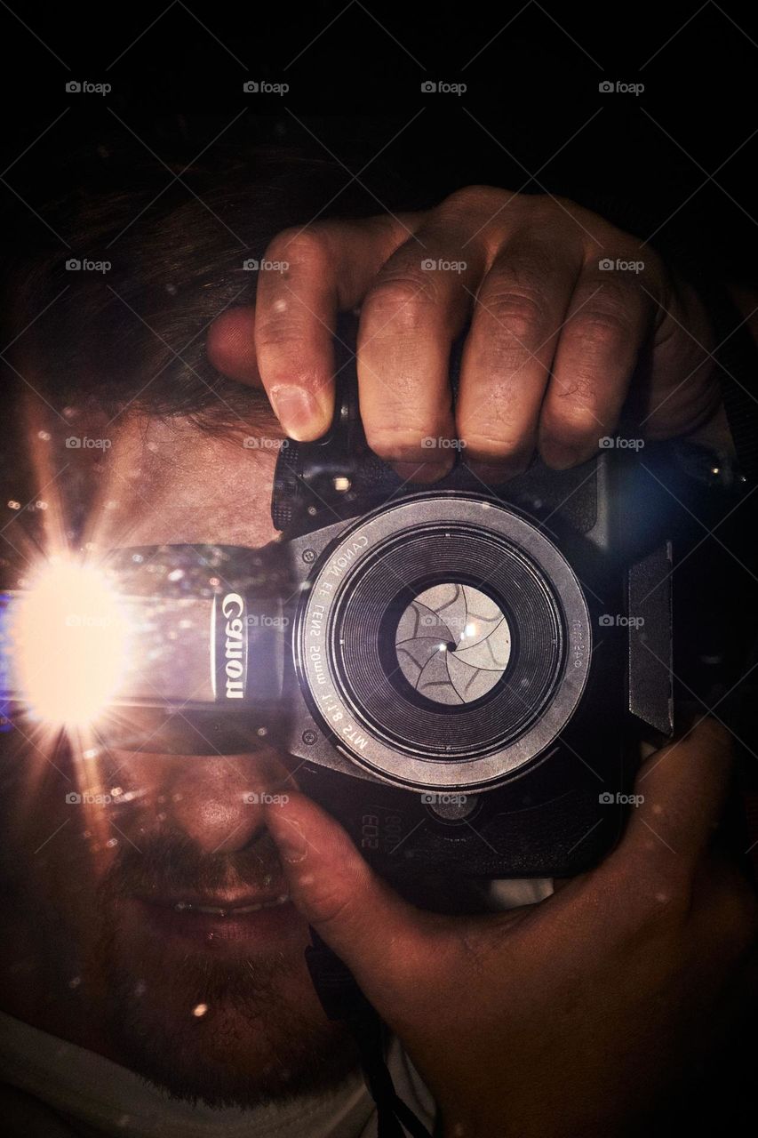 a photo taken in the mirror with the help of the built-in flash of the photo alarm.