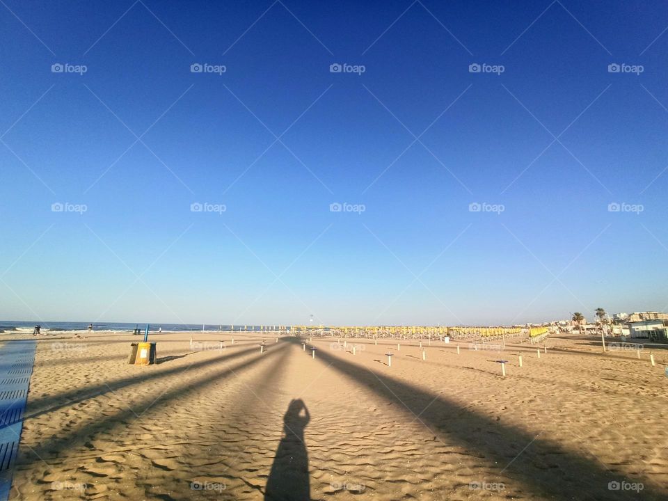 Silhouette on the beach. Shadow . shadow in perspective, beach, summer, walk, travel, Italy