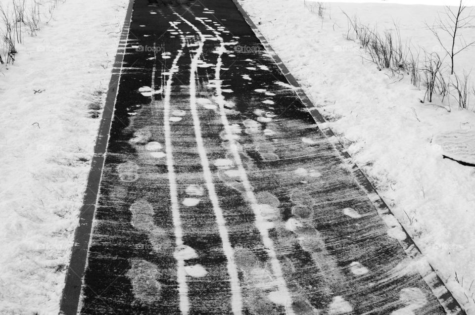 Snowy traces on pavement