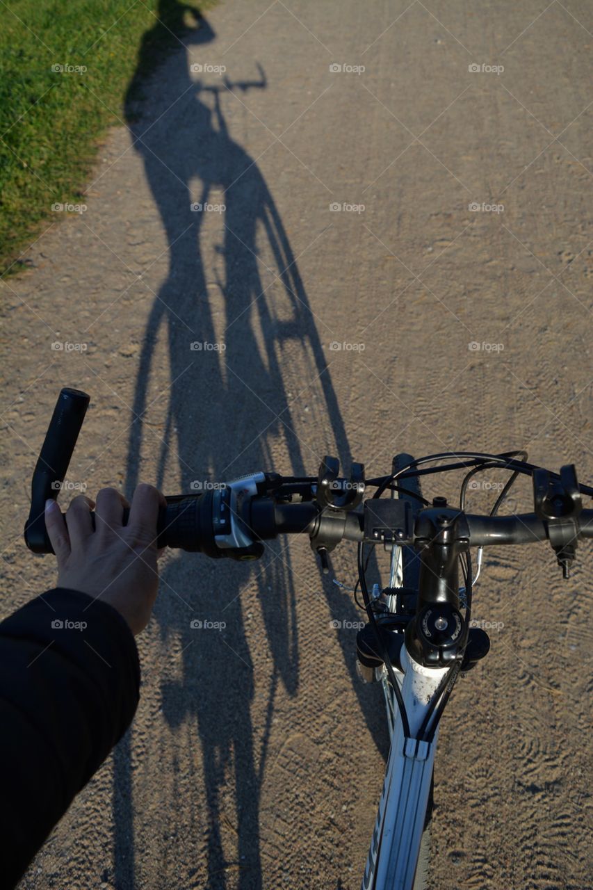 riding bike on a road top view and shadows person