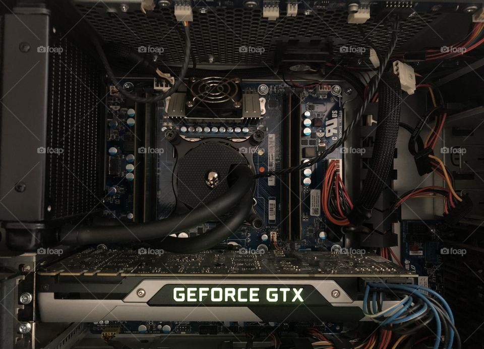 Showcasing the innards of an EXTREMELY powerful Alienware Aurora desktop gaming PC.  Complete with a water cooling system, a Nvidia GTX Graphics card, and an incredible internal lighting system.