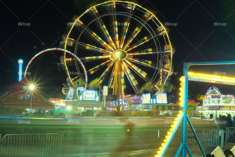 long exposure carnival night festival light motion. fwrris wheel